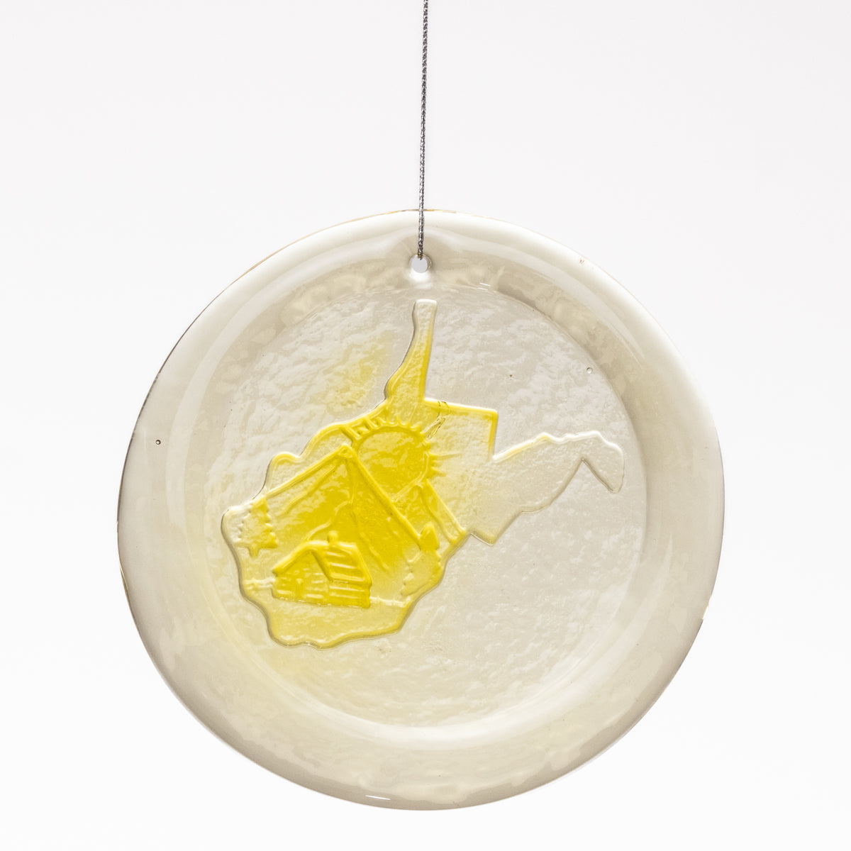 Decorative plate with a yellow elephant design on a white background