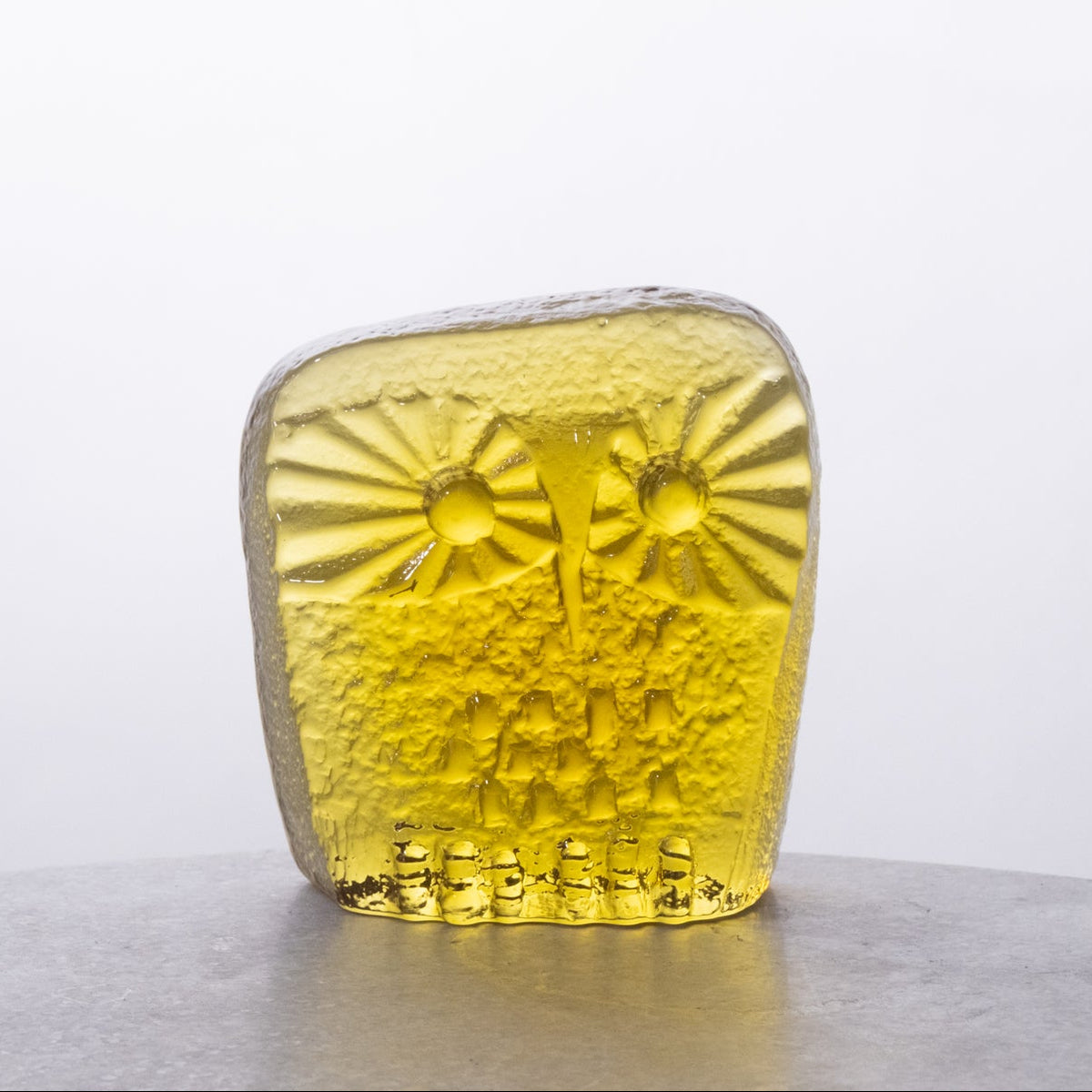 Yellow textured object on a white background