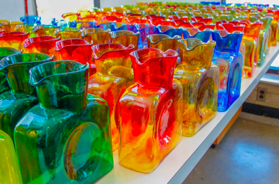image of Blenko 384 water bottles on a white shelf.