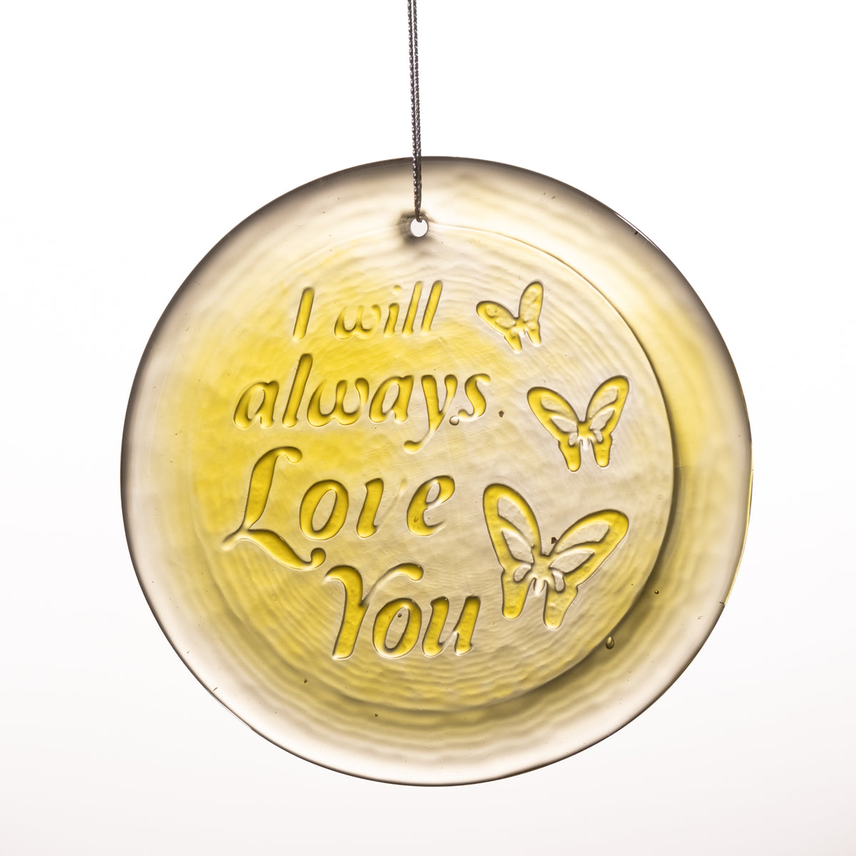 A circular glass suncatcher ornament with a hanging string, featuring the embossed text 'I will always Love You' and butterfly designs on a white background.