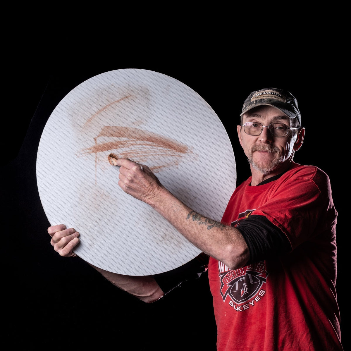 Roger with grinding wheel on a black background
