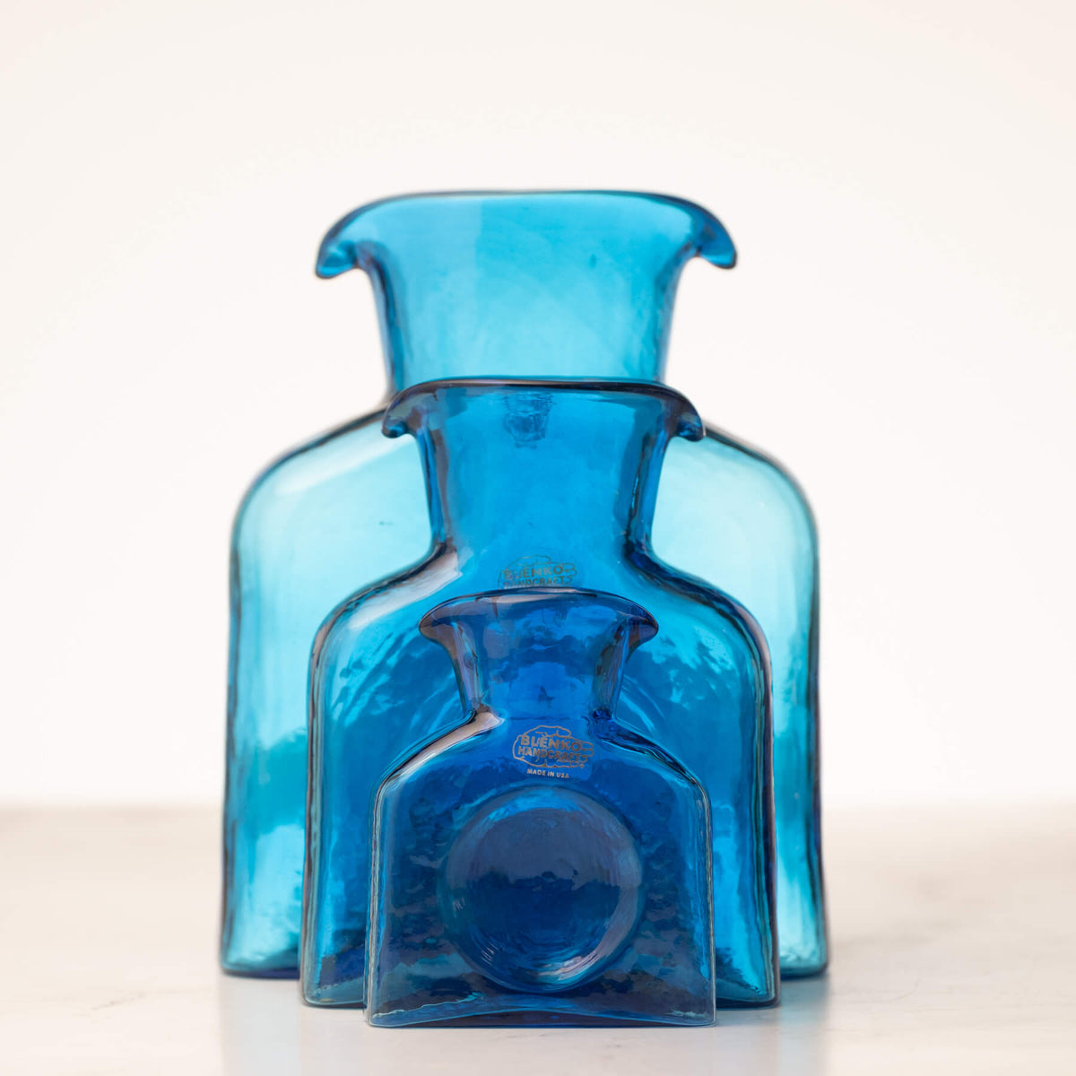 Blue glass vase on a white background