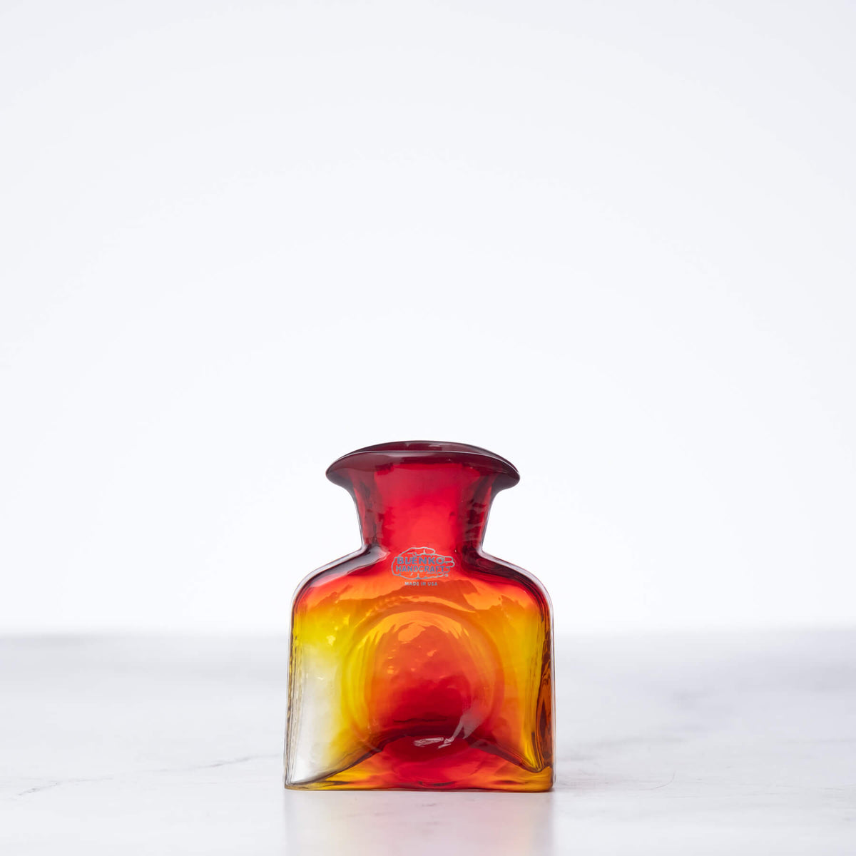 Multicolored glass bottle on a white background