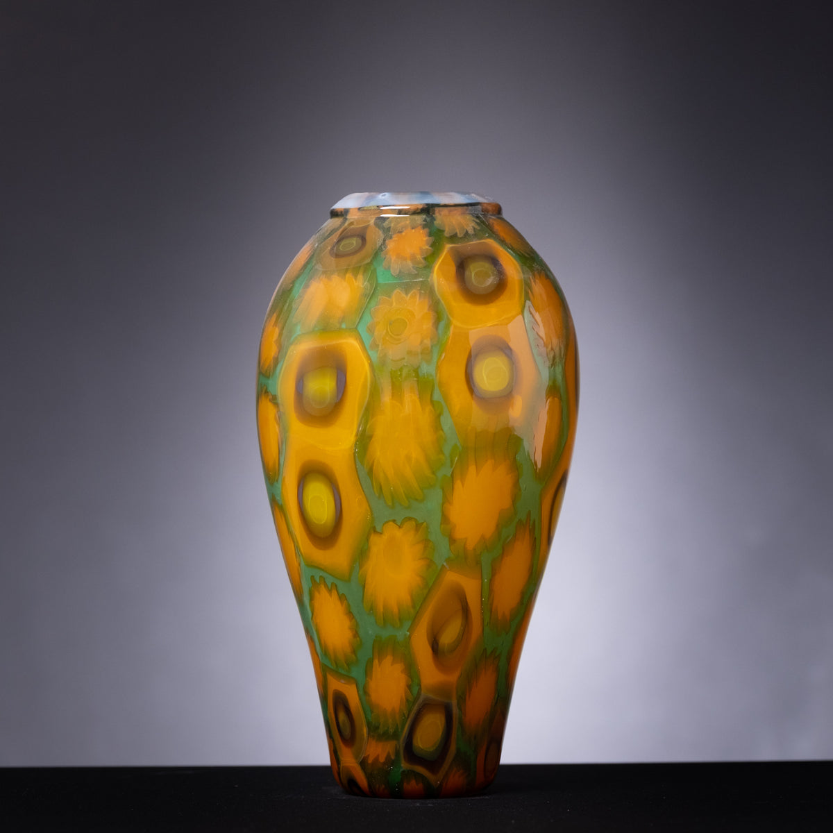 Decorative vase with circular patterns on a gray background
