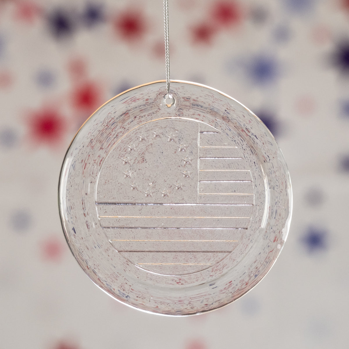 Decorative ornament with American flag design on a colorful background