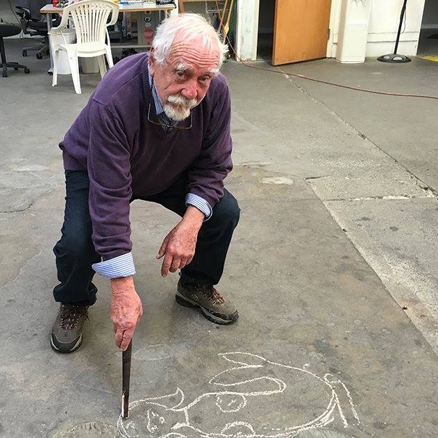 photo of Wayne Husted drawing a design
