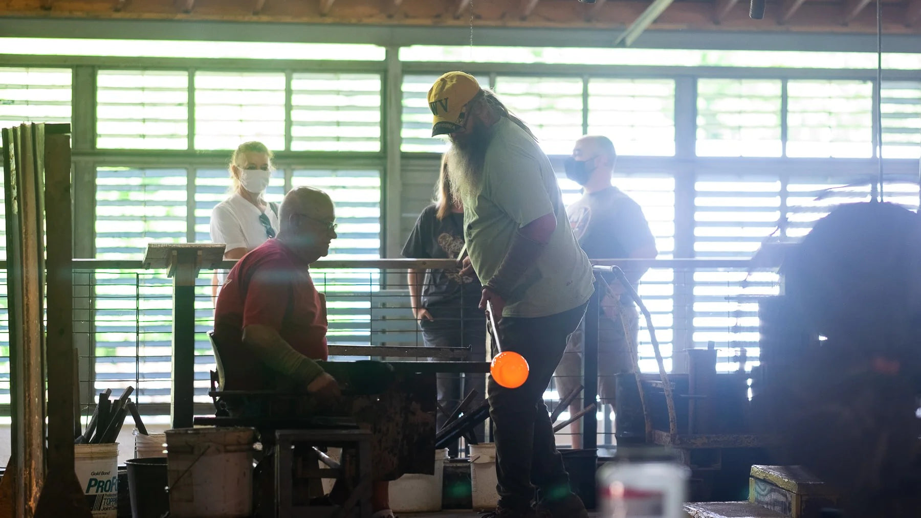 Onlookers watching glass being made