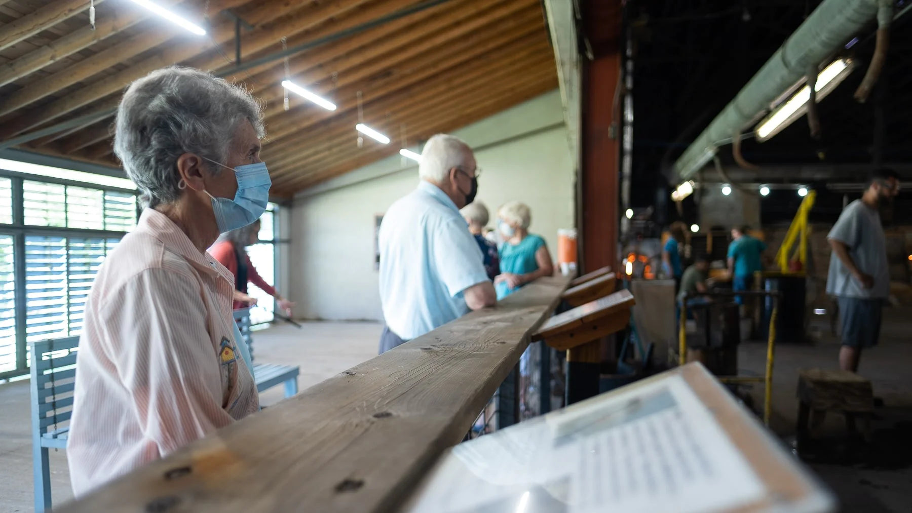 Onlookers watching glass being made