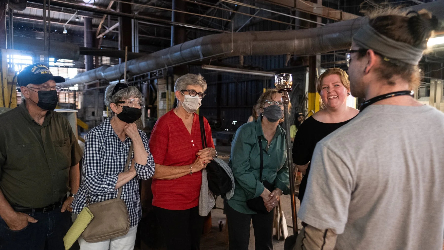 Onlookers watching glass being made