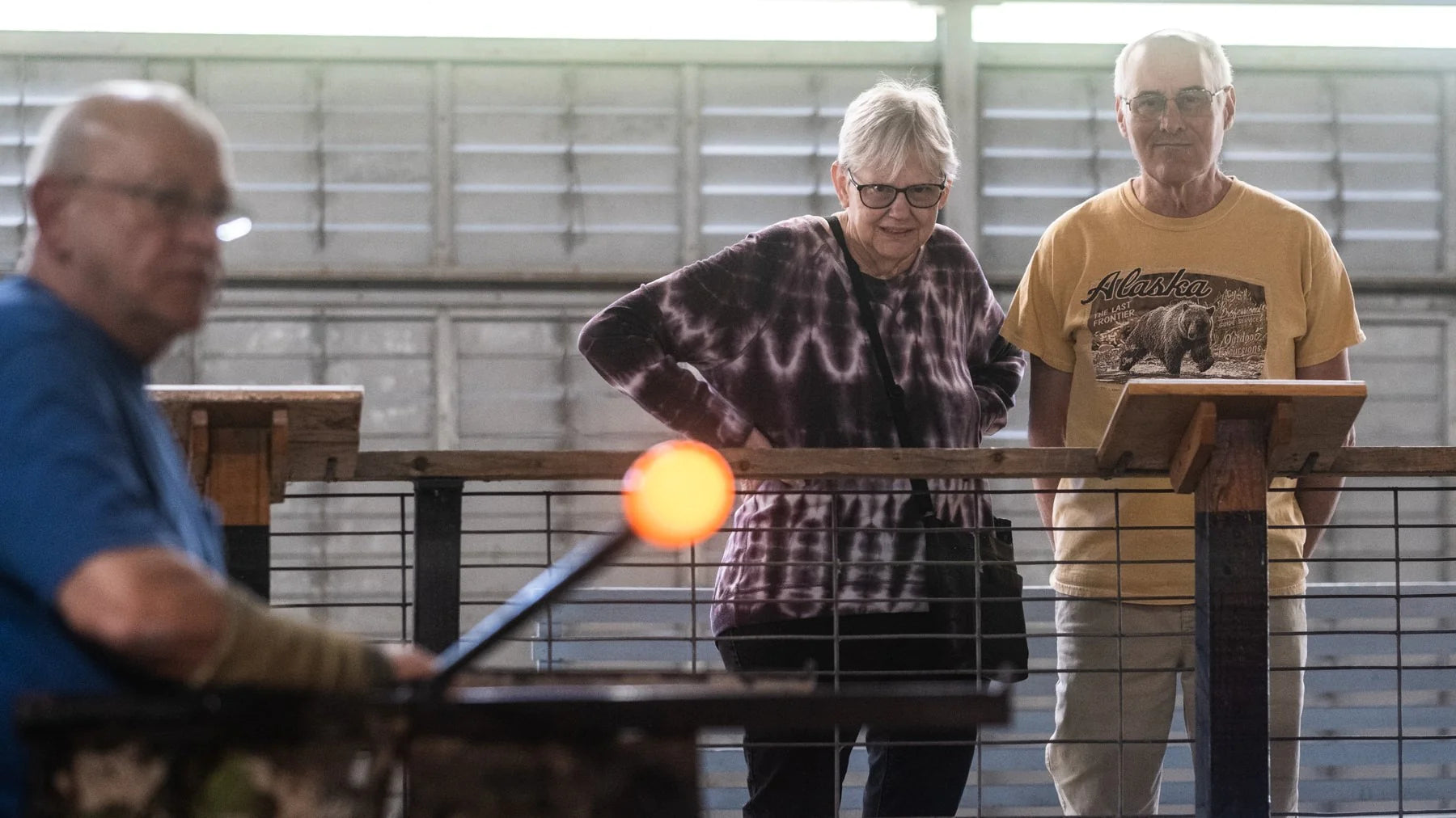 Onlookers watching glass being made